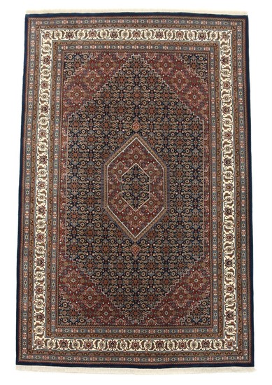 Indian carpet, classic Bidjar design with angular medallion and ornaments on blue base. 20th century. 310×200 cm.