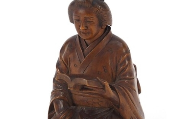 Japanese erotic carved hardwood okimono of a lady kneeling d...