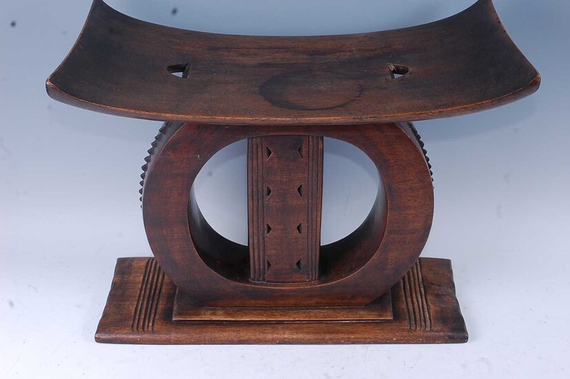 Lot details A large carved hardwood "Elders" type stool,...