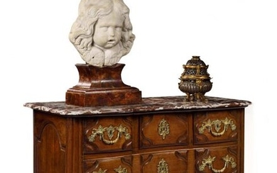 Moulded walnut chest of drawers, the curved front opening with five drawers, the top in red marble from Flanders (added at a later date, with a wooden top originally) resting on rounded uprights joined by a scalloped apron.
