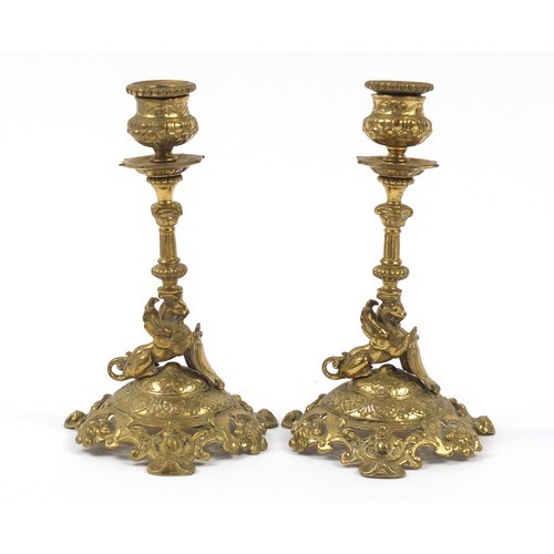 Pair of 19th century classical brass griffin design candlest...