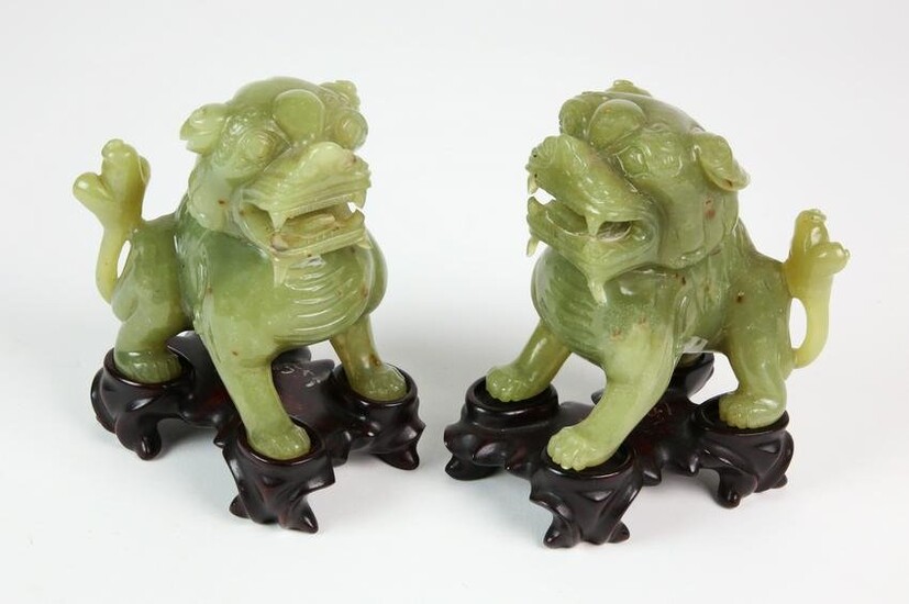 Pair of Chinese Olive Celadon Jade Models of Buddhist Lions