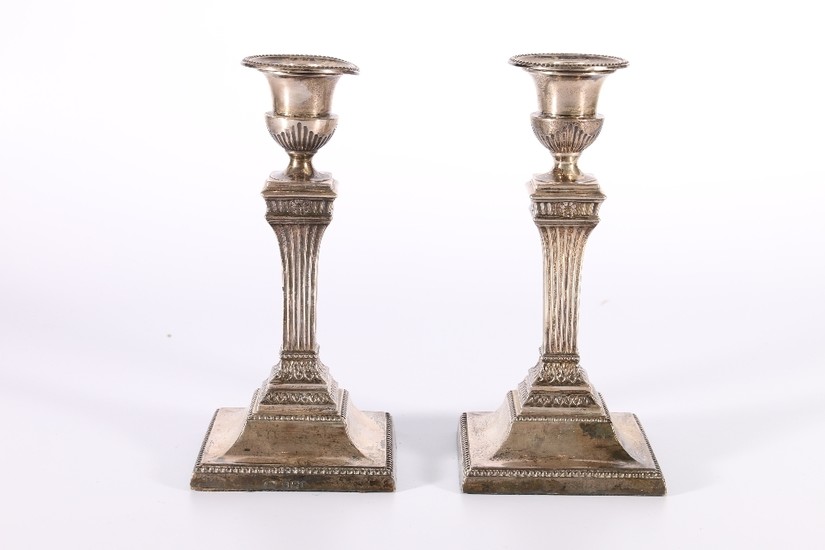 Pair of Victorian silver candlesticks in the classical style...