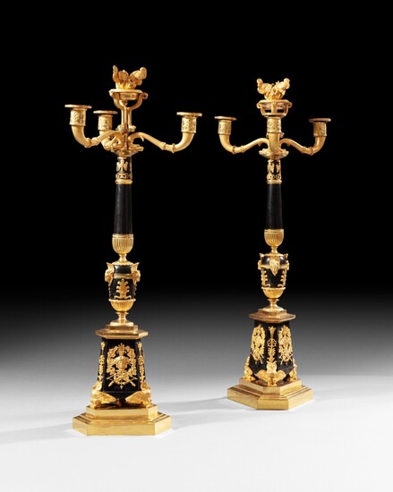 Pair of patinated and giltbronze candelabra, Empire | Paire de candélabres en bronze patiné et doré d'époque Empire