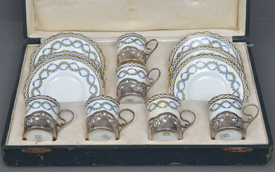 Porcelain cups and saucers (6 pieces) Early 20th century, England. Silver, 925 standart. Porcelain, painting, gilding. Cup height 5.6 cm, saucer diameter 12.2 cm, cup holder height from the particle 5.5 cm. Box - length 37.4 cm, width 26 cm, height 9.5...