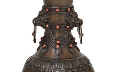 Property of a Gentleman (lots 36-85) A Chinese bronze altar vase, Qianlong mark and of the period, the slender neck with mythical beast mask and loose ring handles, decorated with beaded bands set with coral cabochons above a festoon border further...