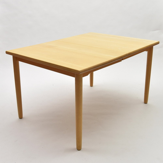 Rectangular extendable wooden dining table, executed by Rubby / Denmark...
