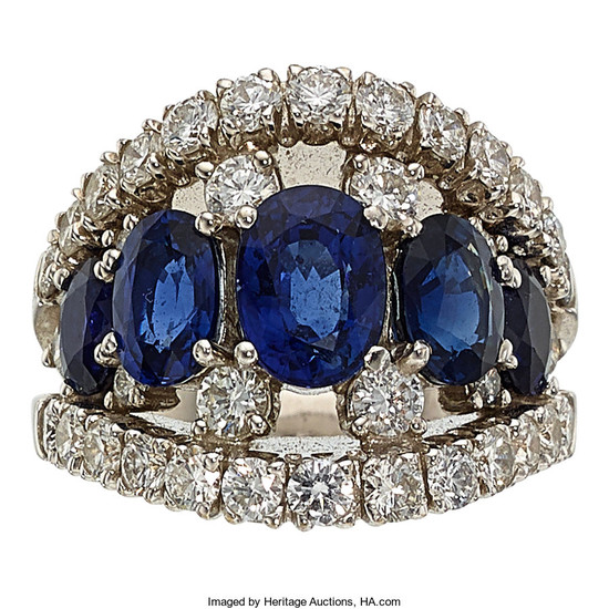 Sapphire, Diamond, White Gold Ring The ring features oval-shaped...