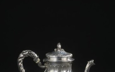 Silver paneled jug with torso ribs and rocailles resting on...