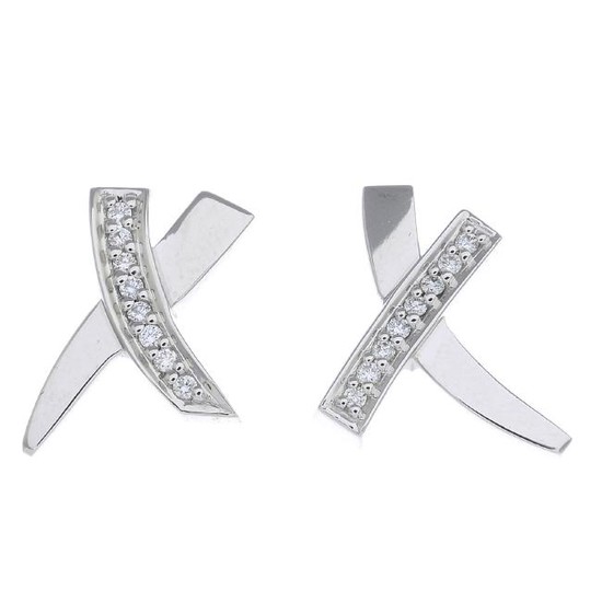 TIFFANY & CO. - a pair of diamond 'Kiss' earrings. Each