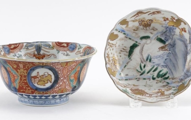 TWO JAPANESE IMARI PORCELAIN BOWLS 1) With a shaped rim, and figural and landscape cartouches on an underglaze blue and white ground...