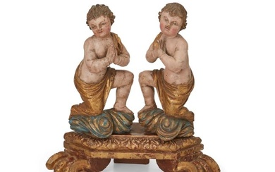 Two Latin American carved wood putti