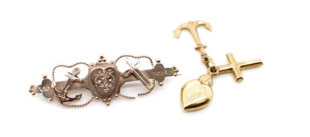 Victorian 9ct rose brooch and a gold charm both representing...