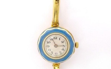 WATCH in 18K yellow gold in a blue and white enamel frame. Round dial, Arabic numerals. Articulated link bracelet. Gross weight : 18.13 gr. An enaml and yellow gold wristwatch.