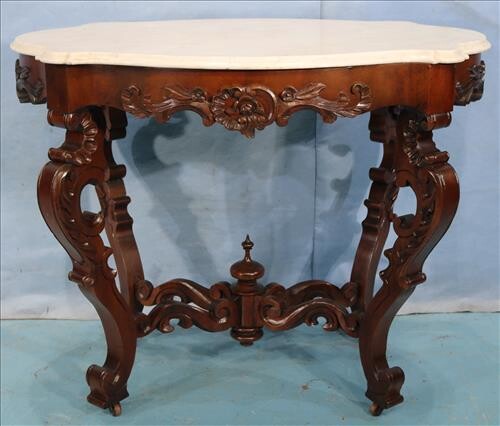 Walnut rococo oval carved center parlor table