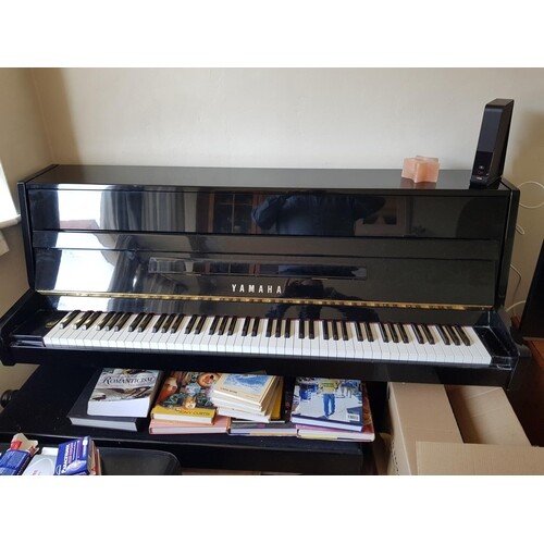 Yamaha (c2004) A Model C109 upright piano in a bright ebonis...