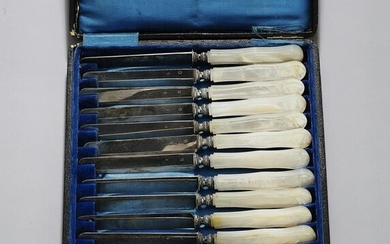 (12) French sterling knives with MOP handles, 19th c.
