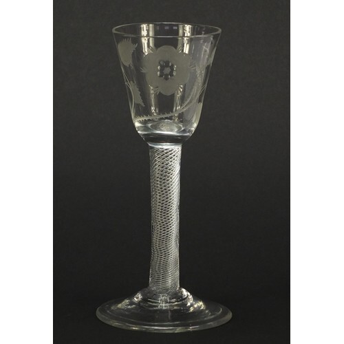 18th century Jacobite wine glass having a rounded funnel bow...