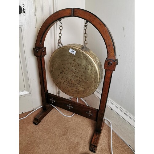 19th. C. brass dinner gong mounted on an oak stand, in the G...
