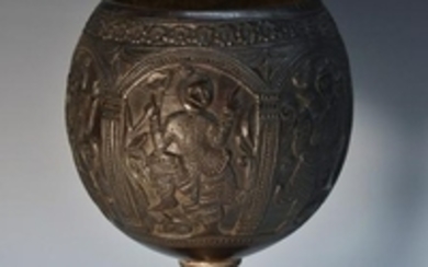 A 19th century Indian coconut cup, the bowl carved with