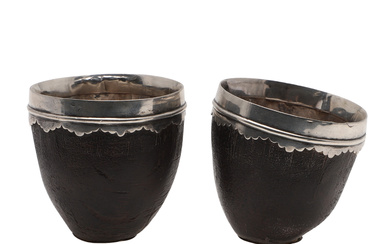 3320652. A PAIR OF SILVER MOUNTED COCONUT CUPS.