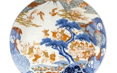 IMARI PORCELAIN CHARGER With decoration of children flying kites before Mount Fuji. Exterior with ho bird and paulownia design. Diam...