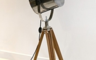 A theatrical stainless steel floor lamp with adjustable...