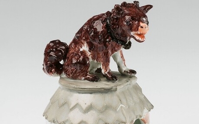 A Meissen porcelain model of a watchdog sitting on its kennel