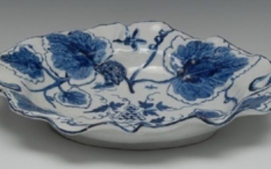 A Bow shaped circular dish, decorated in blue and white