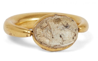 A gold ring with scarab setting, the...
