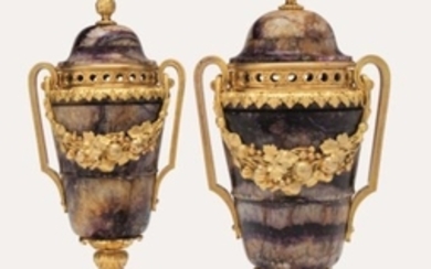 A PAIR OF LOUIS XVI ORMOLU-MOUNTED BLUE-JOHN TWO-HANDLED URNS AND COVERS, CIRCA 1775