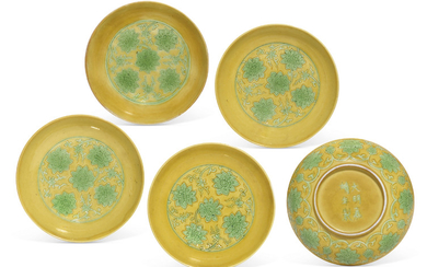 A RARE SET OF FIVE YELLOW-GROUND GREEN-ENAMELLED 'LOTUS' SAUCER DISHES, JIAJING SIX-CHARACTER INCISED MARKS AND OF THE PERIOD (1522-1566)