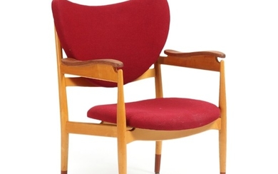 Finn Juhl: A maple armchair with teak shoes and armrests. Seat and back upholstered with reddish wool. Made by Søren Willadsen, Vejen.