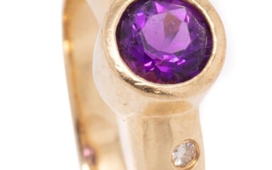 A 14CT GOLD AMETHYST AND DIAMOND RING; rub set with a round cut amethyst to 8.2mm wide round shoulders gypsy set with 4 round brilli...