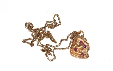 A 1970's 9 carat gold gem set pendant on a...