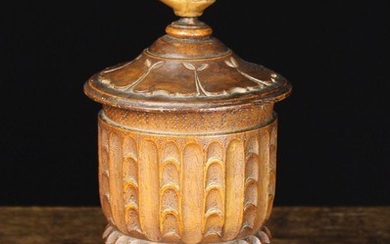 A 19th Century Carved Treen Lidded Tobacco Jar with lead inner liner and lid. The top surmounted by