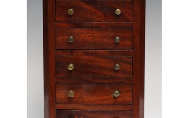 A 19th century mahogany miniature chest, moulded oversailing...