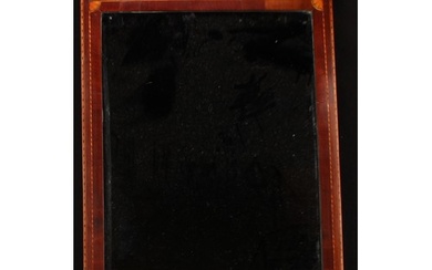 A 19th century mahogany rectangular looking glass, the friez...