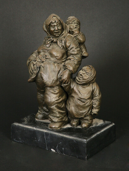 A BRONZE FIGURE IN THE FORM OF A MOTHER AND HER TWO CHILDREN