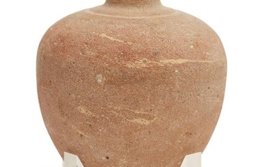 A Bronze Age buff pottery vessel Circa 1500-1200 B.C. With bulbous tapering body, short neck and narrow mouth, an incised band encircling the neck, 10.2cm high Provenance: Accompanied by a certificate of authenticity from ‘Tenmoins Du Temps...