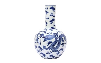 A CHINESE BLUE AND WHITE 'DRAGONS' VASE 清十九世紀 青花雲龍紋瓶