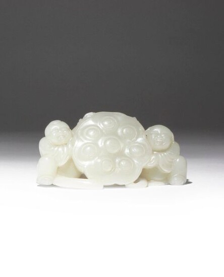 A CHINESE PALE CELADON JADE 'LOTUS AND BOYS' CARVING QING...