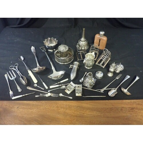 A COLLECTION OF SILVER PLATE to include three toast racks an...