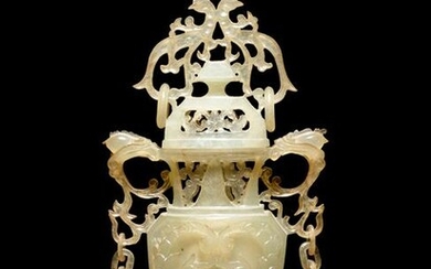 A Carved Serpentine Vase and Cover