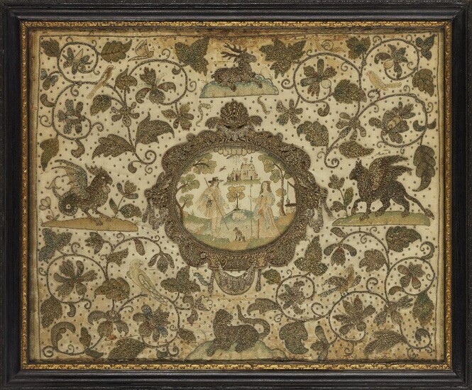 A Charles II silk embroidered panel, c.1660-70, with central oval cartouche of a pastoral scene with two figures holding crooks, a well to the right and a church in the distance, the surround worked in wire threads with exotic animals, birds and...