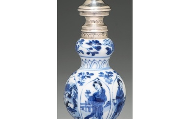 A Chinese blue and white double gourd vase, painted with a y...
