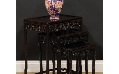 A Chinese hardwood harlequin nest of three occasional tables...