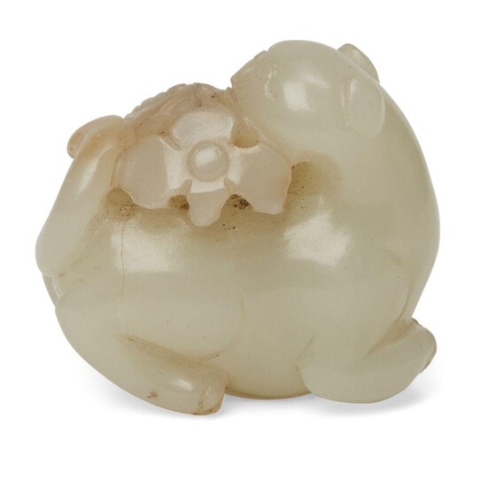 A Chinese pale green jade cat, 19th century, carved as...