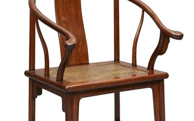 A Chinese rosewood horseshoe back chair, quanyi, 19th century, the curved crestrail terminates in out-swept hooks supported by a curved back splat in the middle and shaped support splats to the sides, the soft mat seat set into the rectangular...