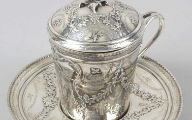 A French silver chocolate cup and saucer.